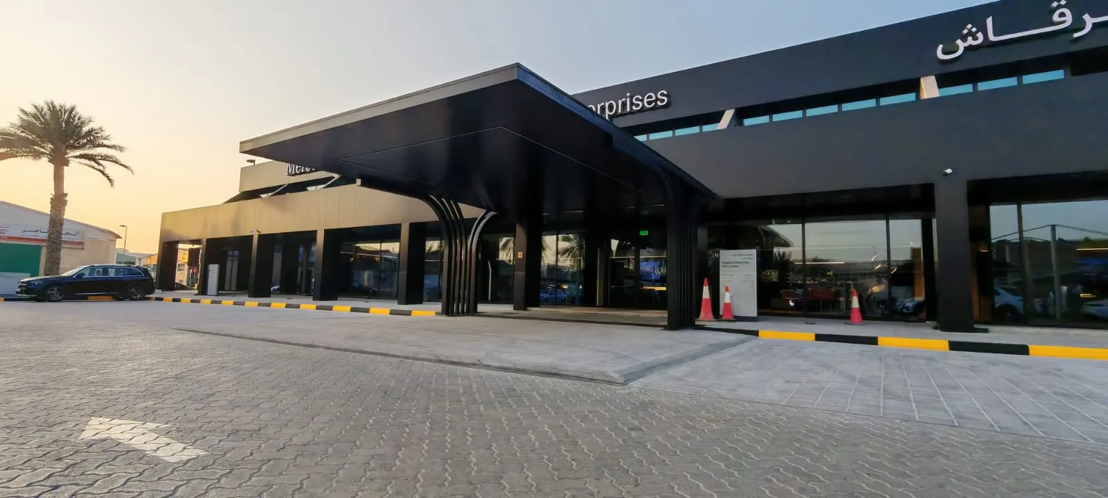 Black steel entrance canopy at a car showroom in the UAE