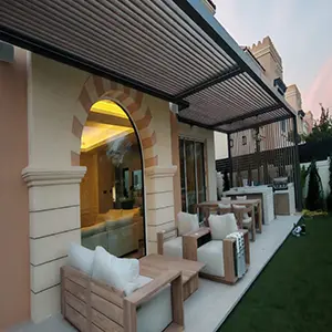 White-glove installed motorized louvered pergola over a villa terrace with outdoor lounge seating